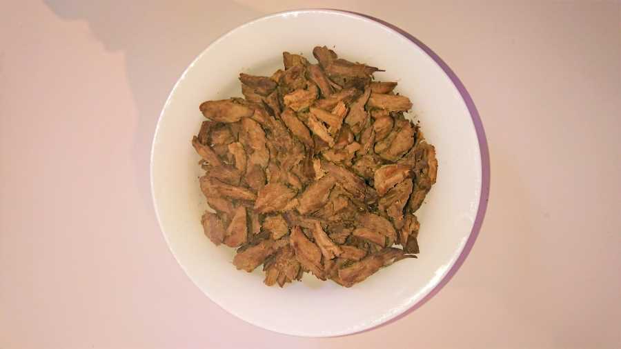 large pieces of shredded beef in a bowl