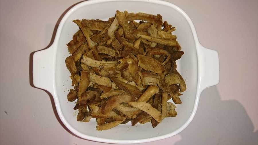 A baking tray full of cooked shredded pork - a tasty and healthy carnivore snack