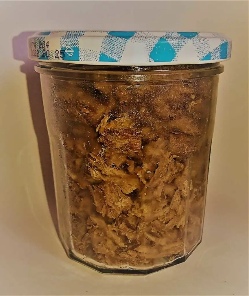A jar of large chunks of shredded beef - a super tasty and healthy carnivore snack