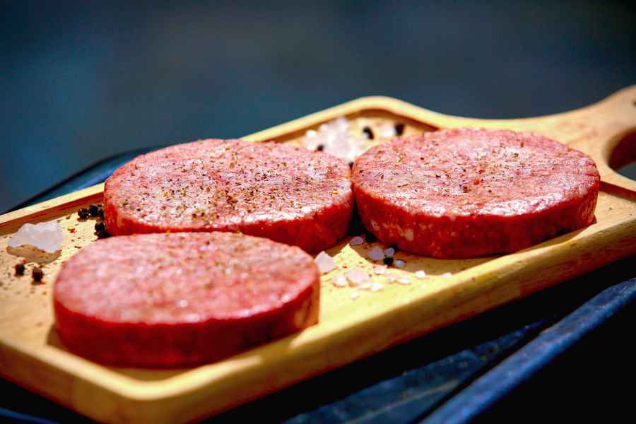 Three beef patties seasoned with spices - herbs and spices are okay on the carnivore diet