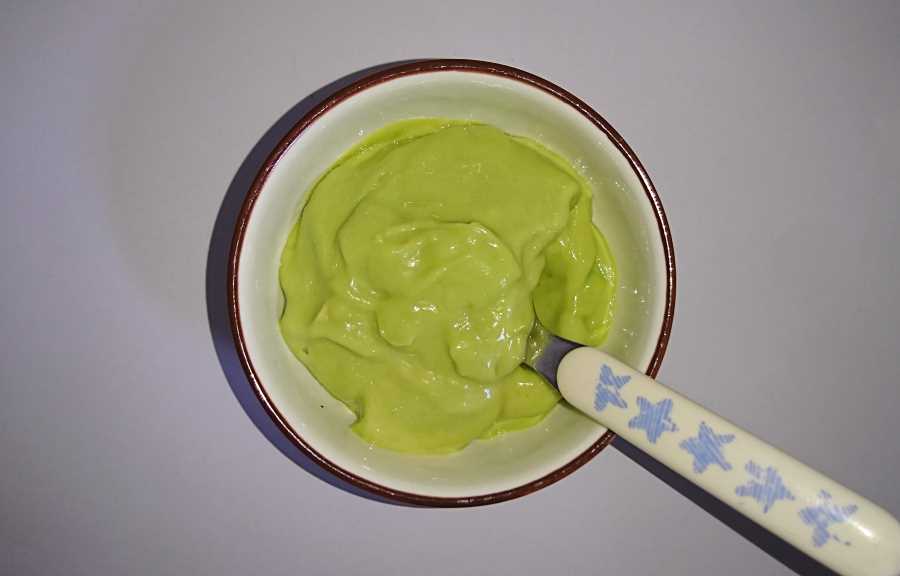 A bowl of ice cream with fruit