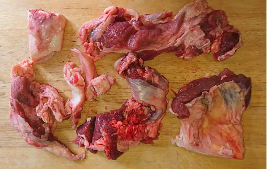 Pieces of beef tendons on a chopping board
