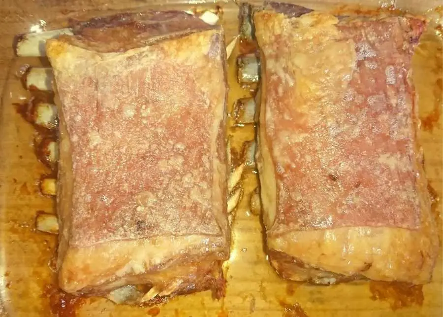 Two lamb rib racks roasted on high to produce crust