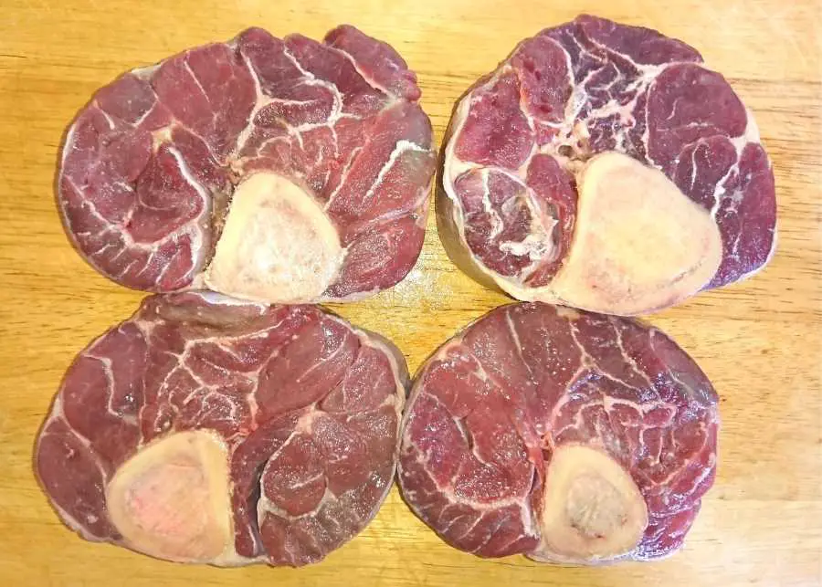 Uncooked osso buco on a chopping board