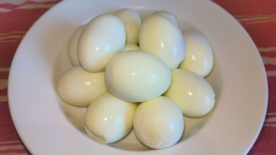 boiled and peeled eggs in a bowl