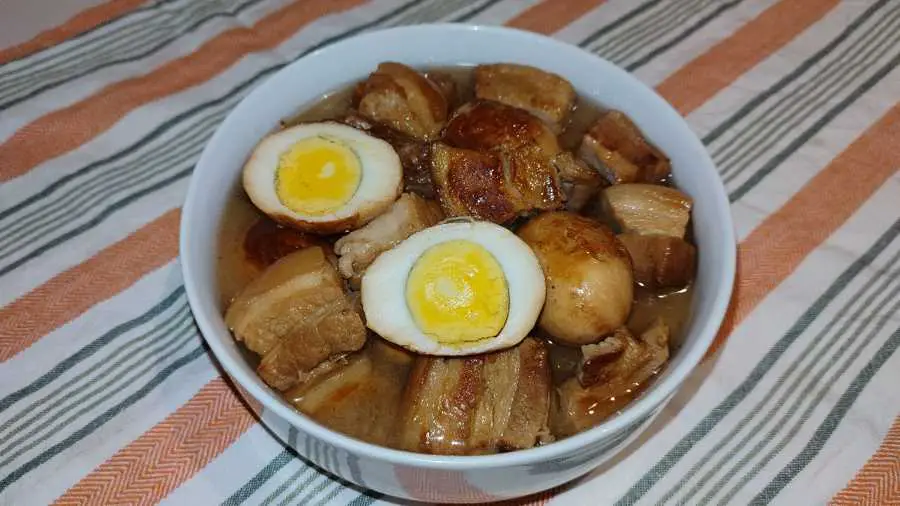 braised pork belly and eggs in a bowl