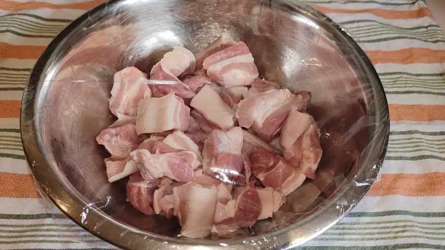 pork belly pieces being marinated