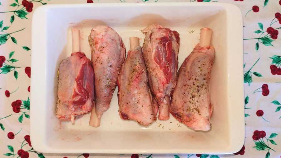 Marinated Frenched lamb shanks in a roasting dish
