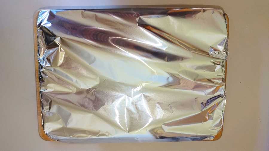 lamb shanks in a roasting dish covered with foil