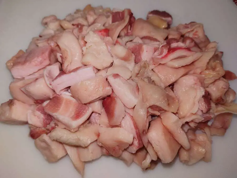 Beef tallow diced on a chopping board