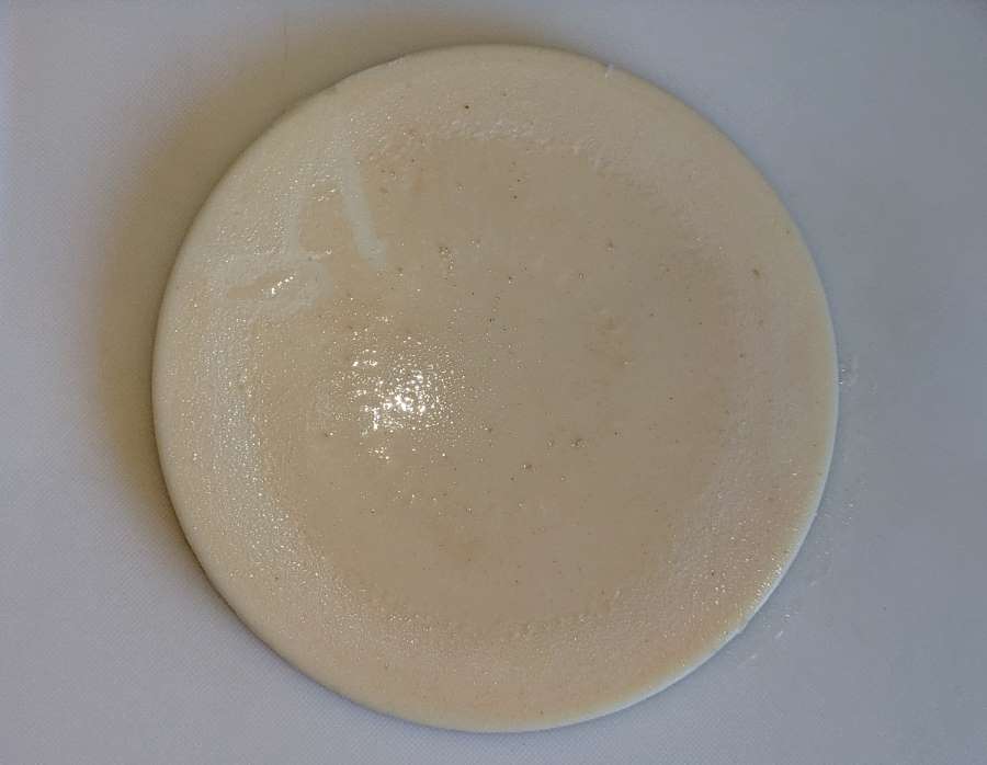 Chunk of beef tallow on a chopping board
