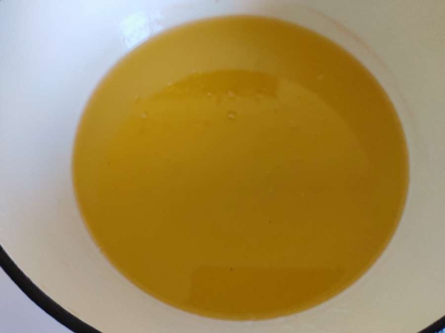 beef tallow in a pot being purified