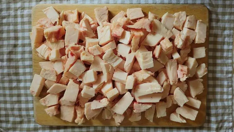 Beef fat dices on a chopping board