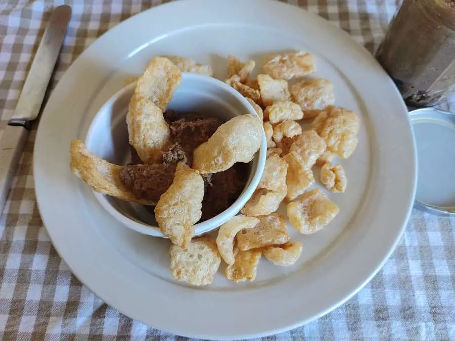 carnivore liver pate in a bowl and pork rinds on a plate