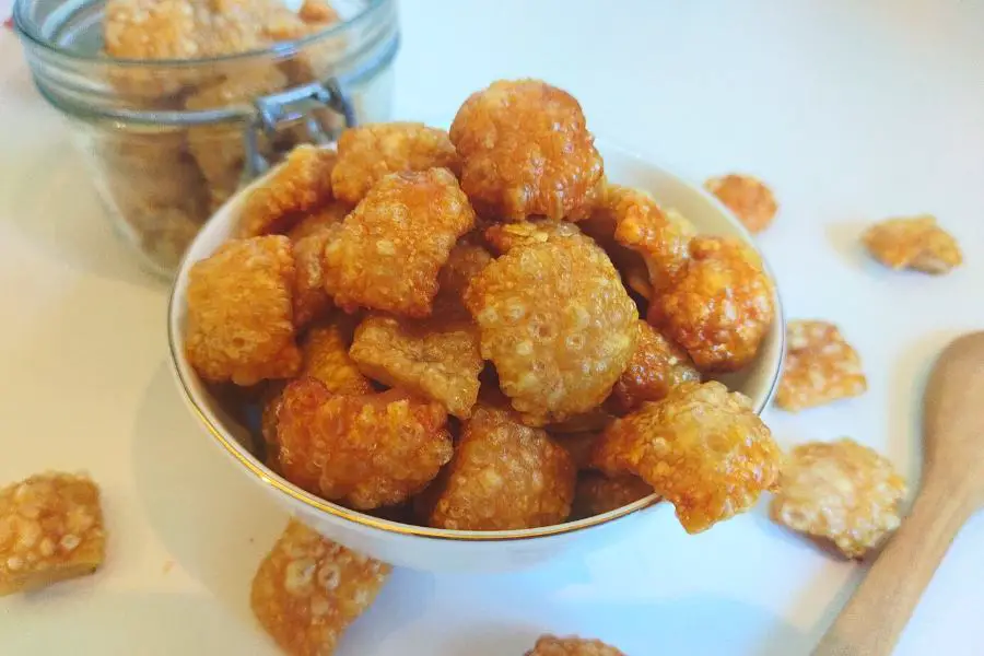 carnivore pork crackling in a bowl and a jar